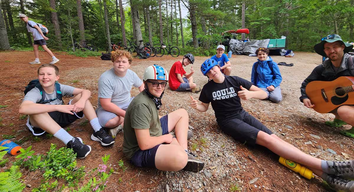 XC Challenge campers relaxing together outdoors