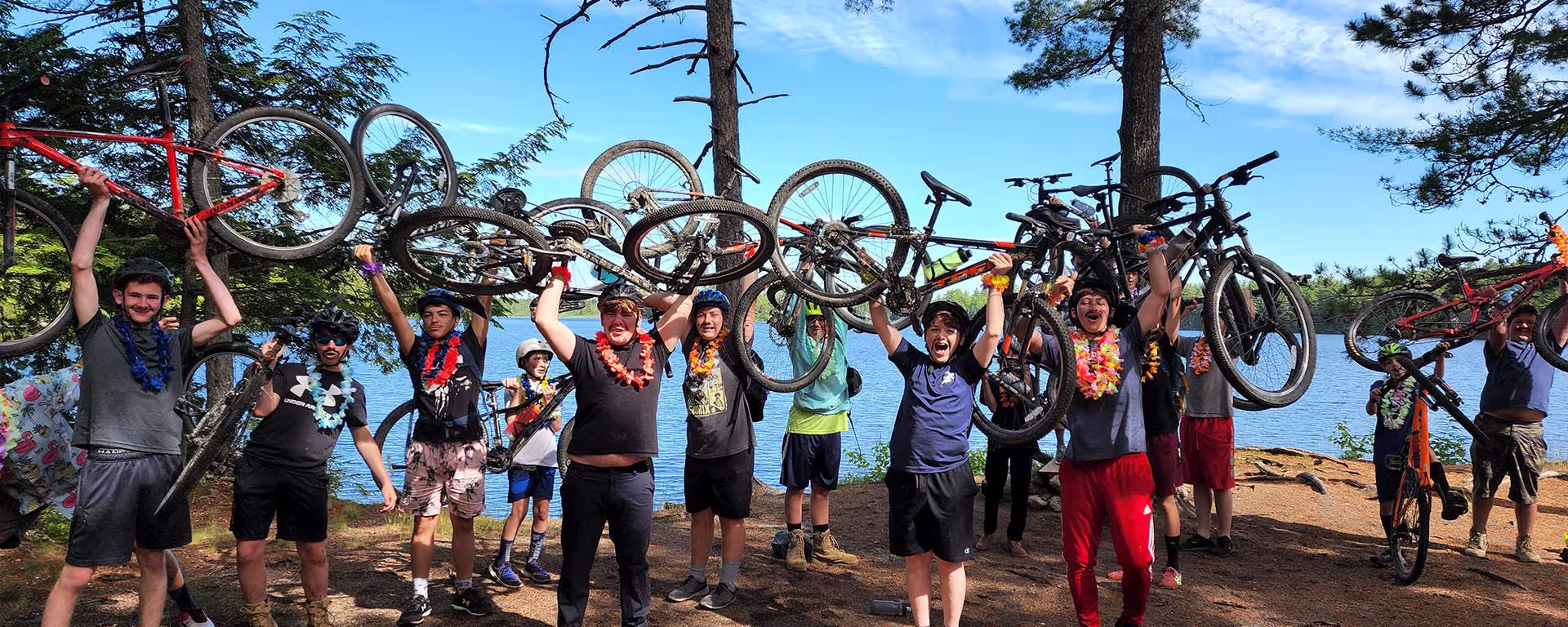 XC Challenge campers celebrating with their bikes